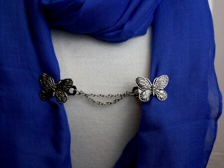 Clips met dubbel ketting vlinder in kleur antiek zilver look.